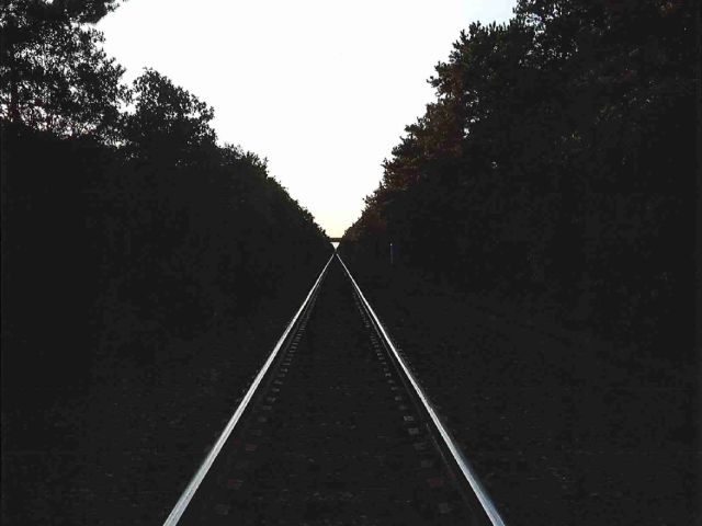 Photo of Train Tracks At Sunset